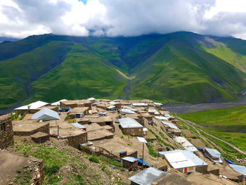 Scenic view of green mountains against sky