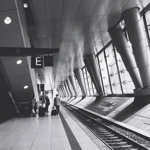 Commuters on railroad platform