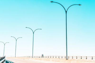 Low angle view of street light against clear blue sky