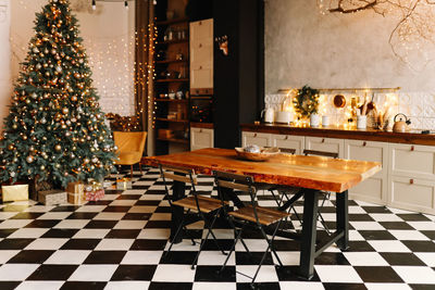 The interior of a christmas decorated kitchen in the loft style in a cozy house