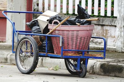 Bicycle in basket on footpath