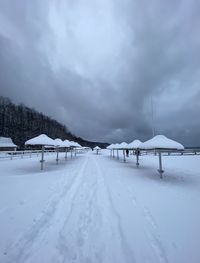 Snow covered road against sky