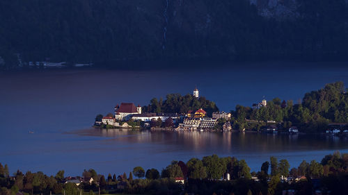 Panoramic view of illuminated buildings at waterfront