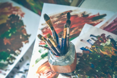 High angle view of paintbrushes on table