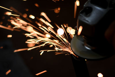 Close-up of hands working in factory