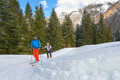 Full length of people on snow covered land