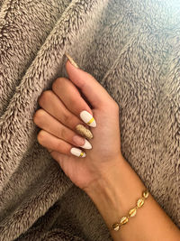 Close-up of woman with nail art