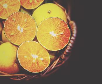 Close-up of lemon slice against black background