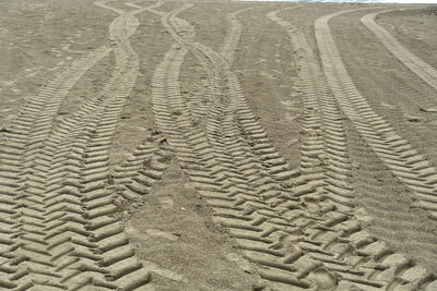 Full frame shot of tire tracks on beach