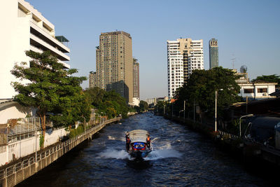 View of river amidst buildings in city
