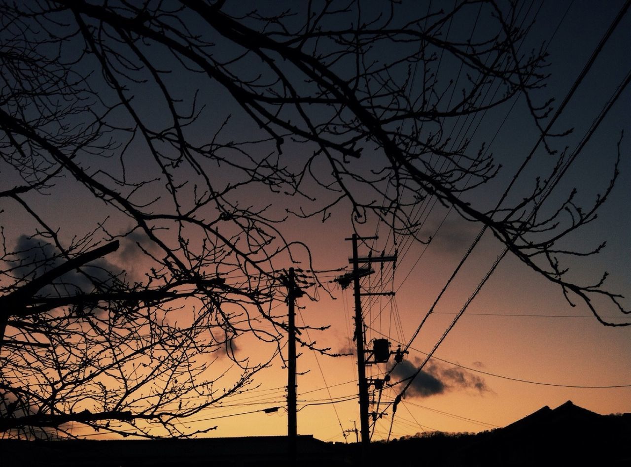 silhouette, sunset, bare tree, sky, branch, tranquility, electricity pylon, tree, scenics, beauty in nature, orange color, tranquil scene, low angle view, nature, power line, dusk, connection, outdoors, no people, landscape