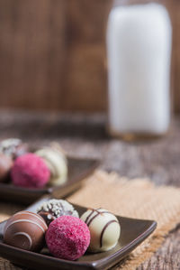 Close-up of chocolate truffles in plate on table