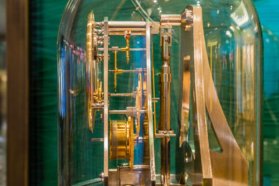 Close-up of clock mechanism in glass