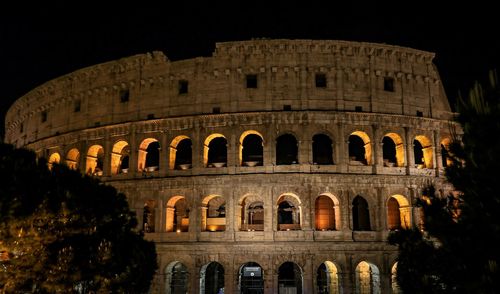 Low angle view of historical building at night