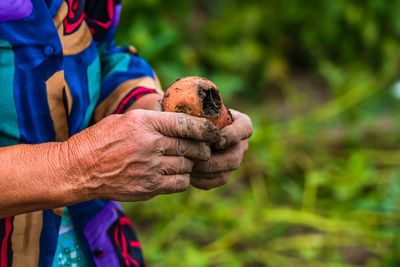 Close-up of man holding ice cream