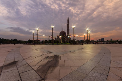 Panoramic view of city buildings against sky during sunset