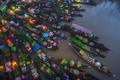 High angle view of illuminated boats in water