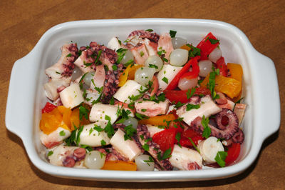 High angle view of chopped fruits in bowl on table