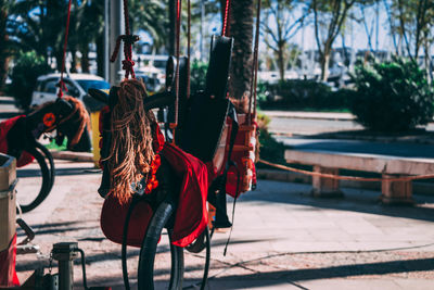 Clothes hanging on footpath in city