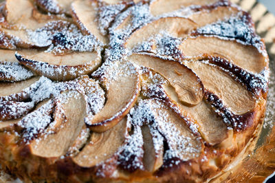 Close up of an apple cake with white sugar on the top. handmade apple