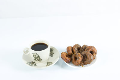 Close-up of coffee cup against white background