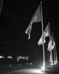 Low angle view of flag against sky at night