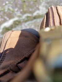 Close-up of hat on sand