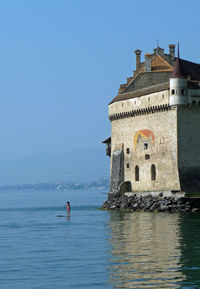 Castle chateau chillon at sea against clear sky