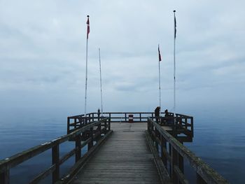 Pier over sea against sky