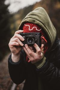 Midsection of man photographing