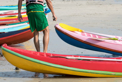 Rear view of siblings on beach