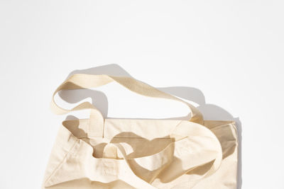 Close-up of bag against white background