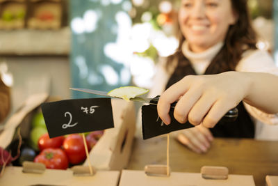 Cropped hands of man working on table