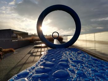 Close-up of swimming pool against sky during sunset