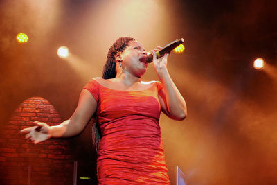 Female singer performing live