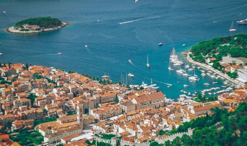 High angle view of townscape by sea