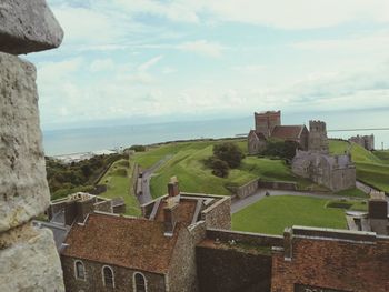 Castle by sea against sky