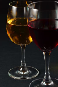 Close-up of wine glasses on table