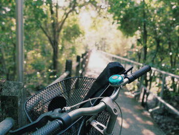 Close-up of bicycle against trees