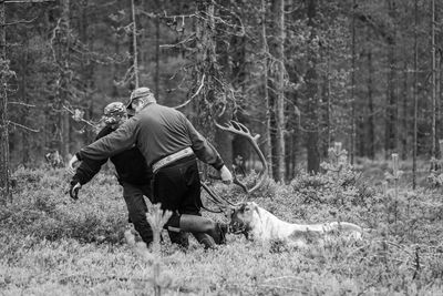 Rear view of man in forest