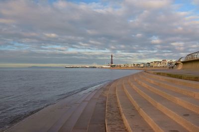 Scenic view of sea and sea front against sky during sunset