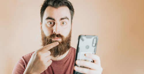 Portrait of young woman using mobile phone