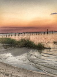 View of calm beach at sunset