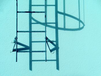 Ladder on turquoise wall