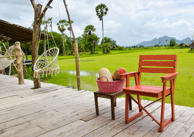 Empty chairs and tables at outdoor cafe