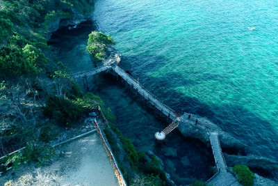 High angle view of water flowing over sea