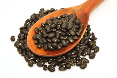 Close-up of coffee beans on white background