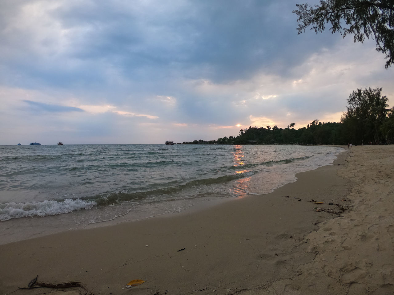 SCENIC VIEW OF BEACH DURING SUNSET