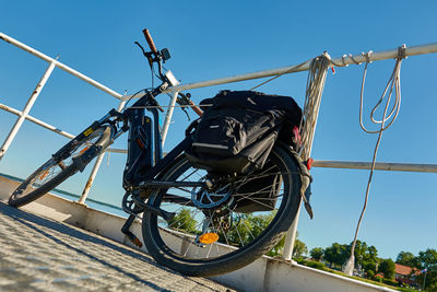 Low angle view of bicycle against clear sky