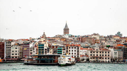 View of buildings and ferry in galata